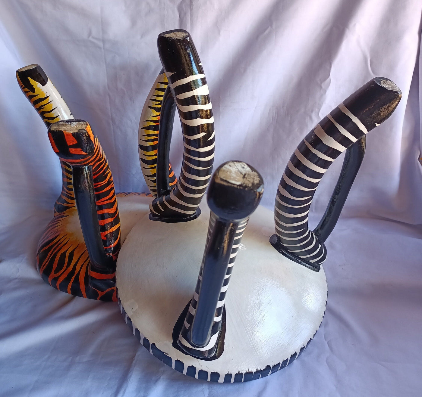 Two Gorgeous Hand carved Tiger and Zebra 3 legged Stools set of 2 with Handles. Modern maasai Wildlife Themed Stools. Bulk.The Senufo pair