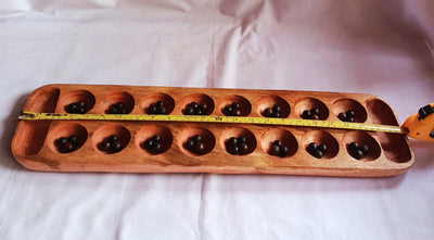 Wholesale . Large 24"×6" Mancalla Board Game With Natural Black Seeds.2 opponents Mankala 60 by 15 Cm with 16 Depressions and edge stores.