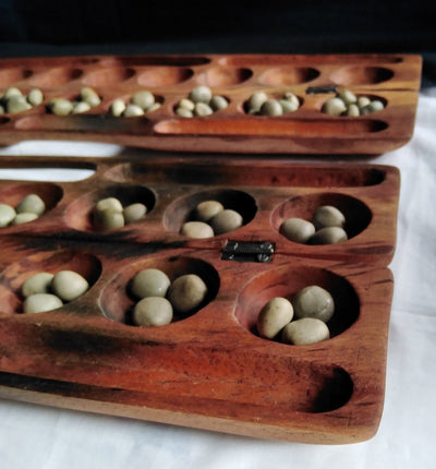 Antique Mancala Board Game. Vintage Bao Board Game. Traditional Bao Ajua Game.Hawalis Game of Oman. Omwes with Sago palm seed Balls/marbles