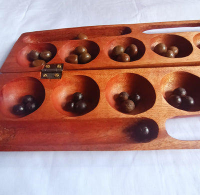 Antique Mancala Board Game. Vintage Bao Board Game. Traditional Bao Ajua Game.Hawalis Game of Oman. Omwes with Sago palm seed Balls/marbles