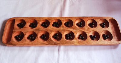Wholesale . Large 24"×6" Mancalla Board Game With Natural Black Seeds.2 opponents Mankala 60 by 15 Cm with 16 Depressions and edge stores.