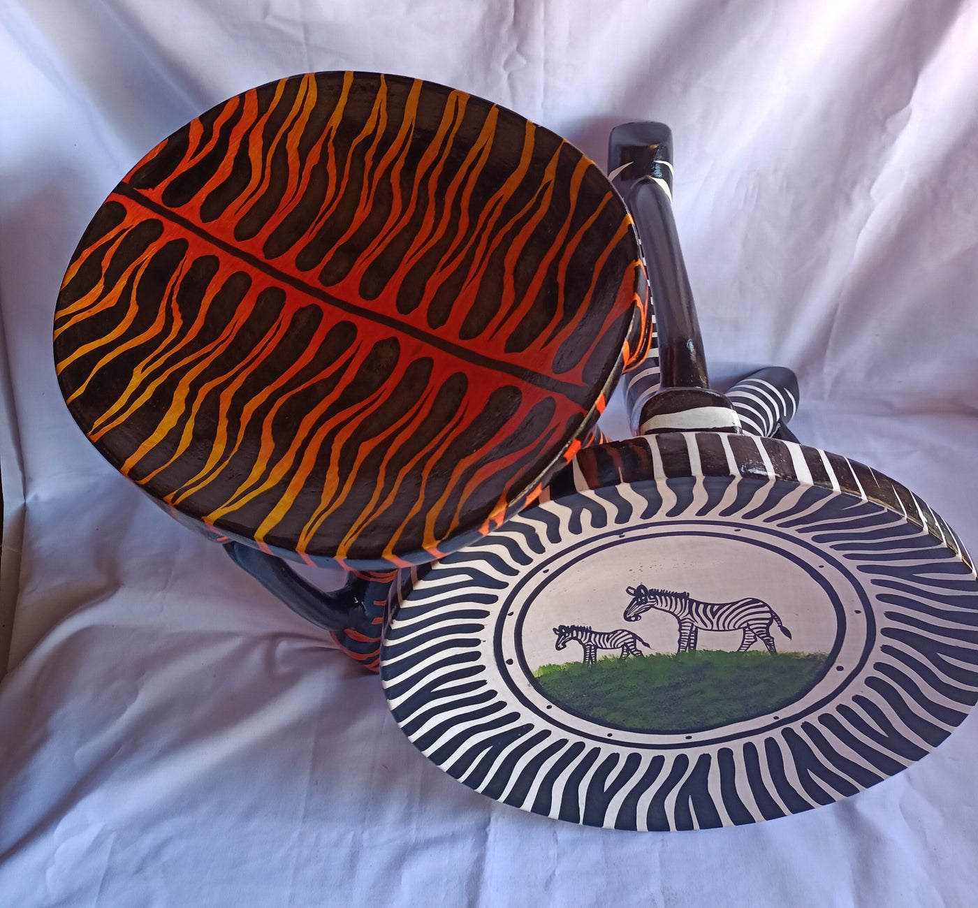 Two Gorgeous Hand carved Tiger and Zebra 3 legged Stools set of 2 with Handles. Modern maasai Wildlife Themed Stools. Bulk.The Senufo pair
