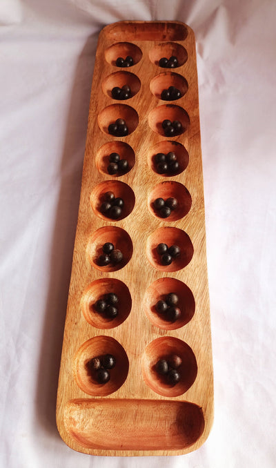 Wholesale . Large 24"×6" Mancalla Board Game With Natural Black Seeds.2 opponents Mankala 60 by 15 Cm with 16 Depressions and edge stores.
