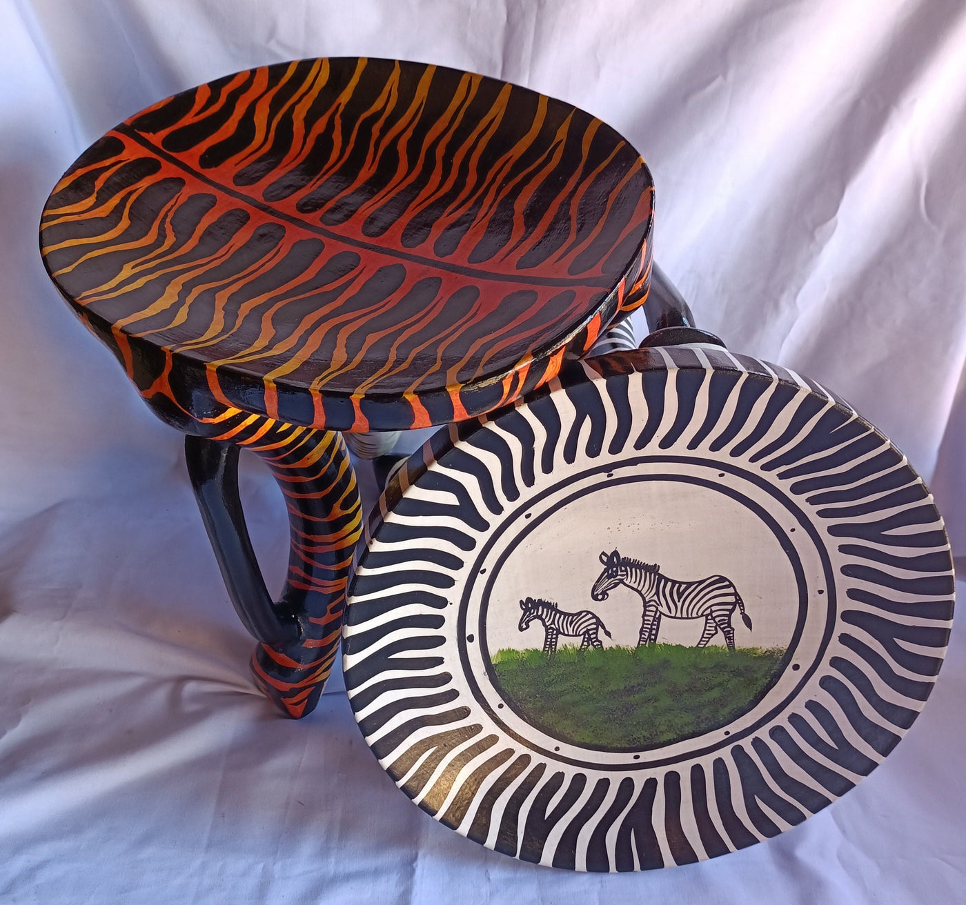 Two Gorgeous Hand carved Tiger and Zebra 3 legged Stools set of 2 with Handles. Modern maasai Wildlife Themed Stools. Bulk.The Senufo pair